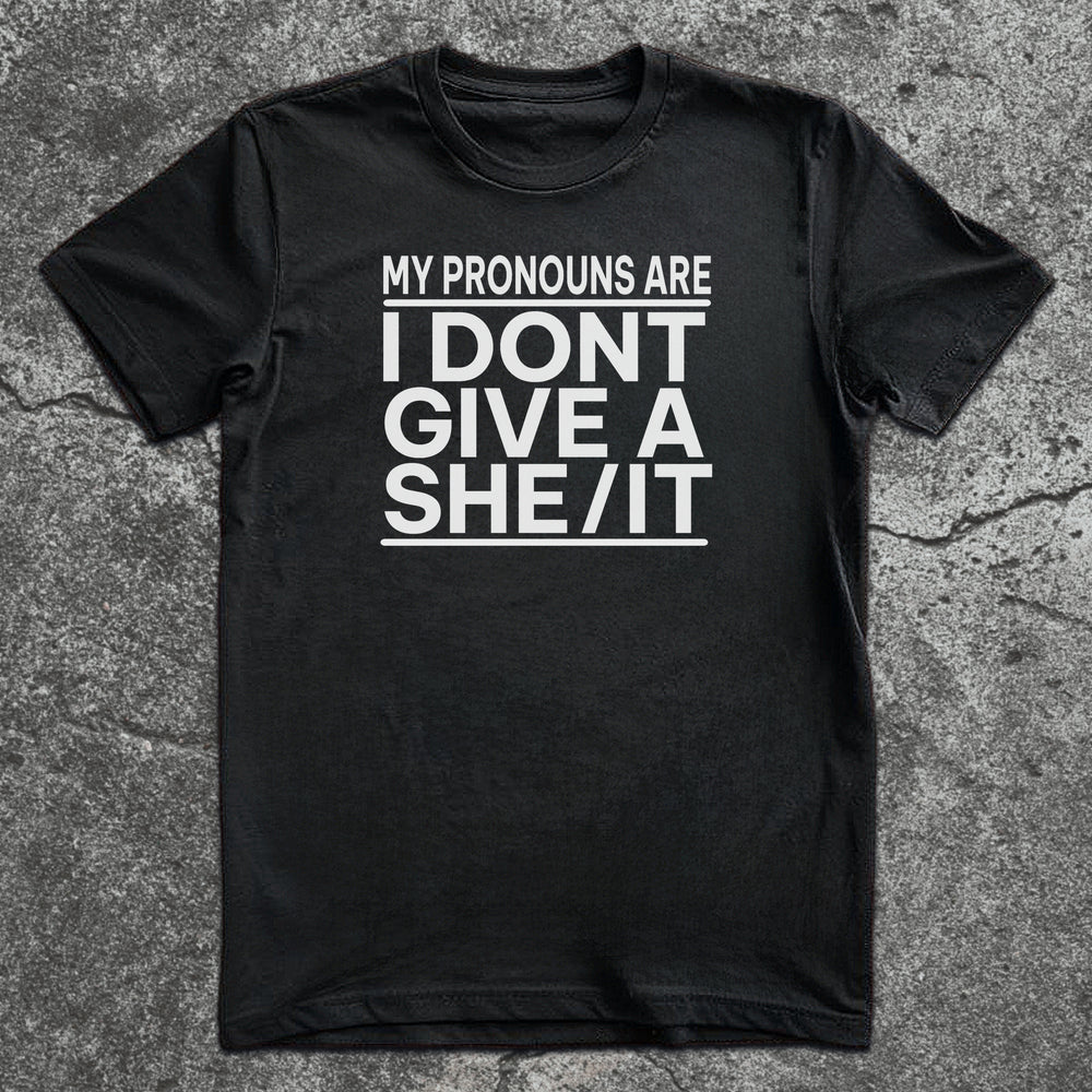 Black t-shirt with white bold text: “My Pronouns Are I Don’t Give a She/It”